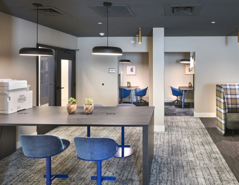 VERVE Boise study area with printer, desks, and private rooms