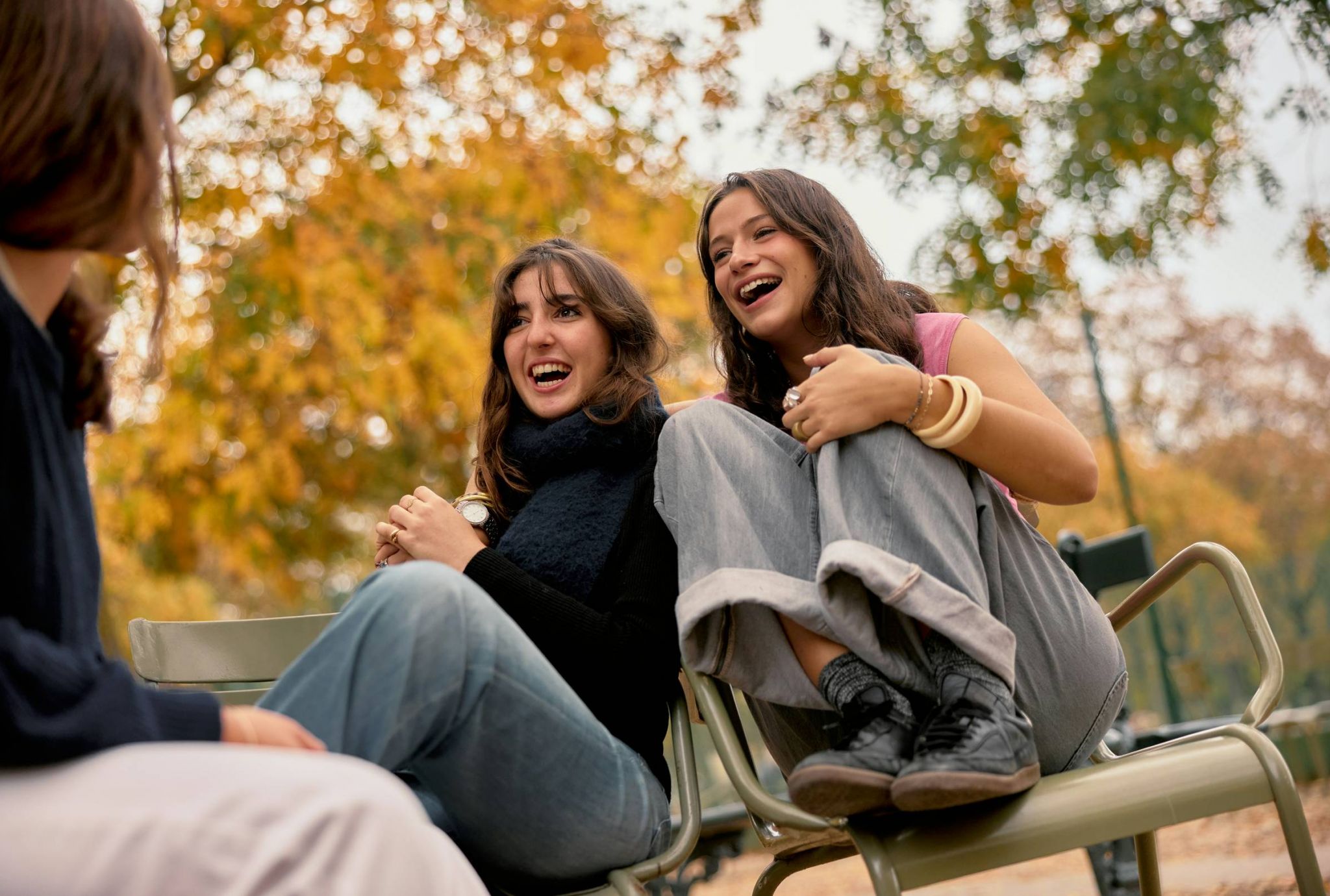 Friends laughing in a park