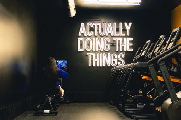 VERVE Boise fitness center with modern exercise equipment and TVS.