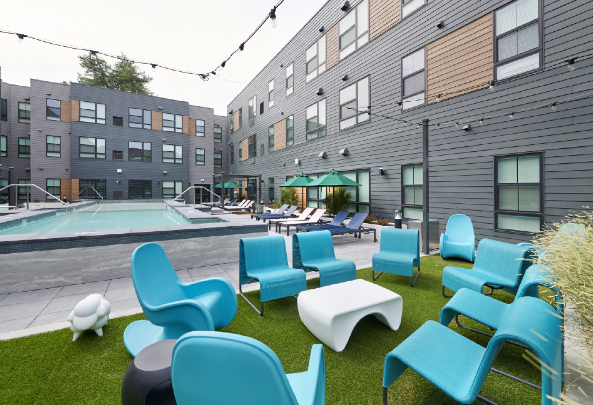 VERVE Boise outdoor courtyard with pool and lounge seating.