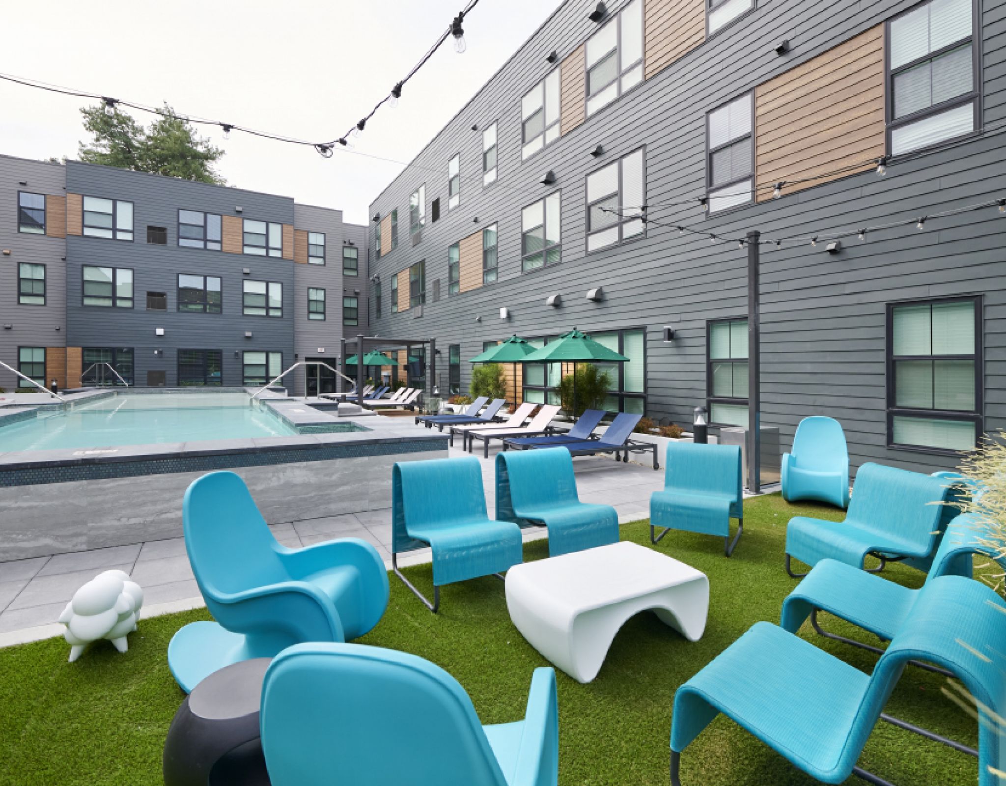 VERVE Boise outdoor courtyard with pool and lounge seating.